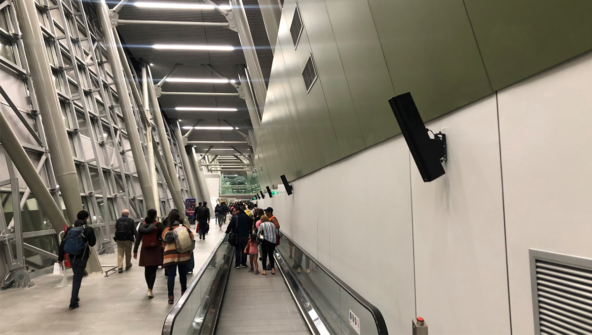 QSC Loudspeakers mounted along the airport wall