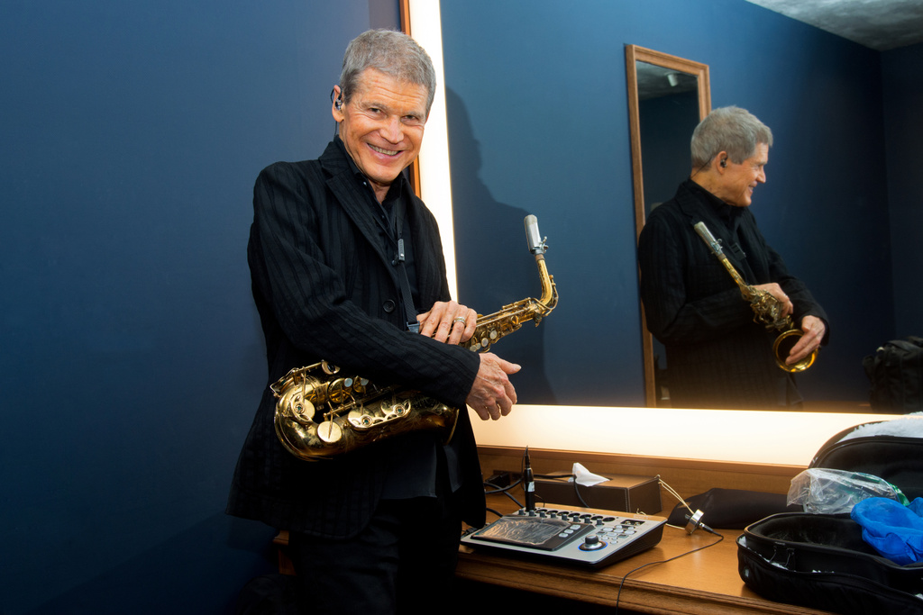 David Sanborn posing with his Saxophone