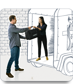 Image of a man helping load speakers into a trailer